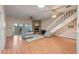Spacious living room with fireplace, sliding glass doors, and hardwood flooring at 903 Belle Oak Dr, Leesburg, FL 34748