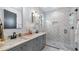 Elegant bathroom showcasing a walk-in shower, dual vanity, and modern finishes at 9134 Mossy Oak Ln, Clermont, FL 34711