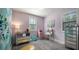 Cozy bedroom with light purple walls, mirrored furniture, and ample natural light at 9134 Mossy Oak Ln, Clermont, FL 34711