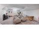 Spacious bonus room featuring beanbags, artwork, and fitness equipment at 9134 Mossy Oak Ln, Clermont, FL 34711