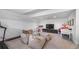 Spacious bonus room with neutral tones, comfortable beanbags, and entertainment center at 9134 Mossy Oak Ln, Clermont, FL 34711