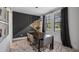 Modern dining room with a dark wood table, gray chairs, and stylish decor at 9134 Mossy Oak Ln, Clermont, FL 34711