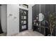 Modern entryway with a black multi-paneled front door and stylish decor at 9134 Mossy Oak Ln, Clermont, FL 34711