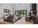 Spacious living room features high ceilings, fireplace, and sliding glass doors for seamless indoor-outdoor living at 9134 Mossy Oak Ln, Clermont, FL 34711