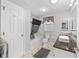 Neutral bathroom with tub and shower combo, decorative tile accents, and an elegant vanity at 923 Oleander St, The Villages, FL 32159