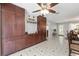 Dining area with dark wood built-ins, a neutral color scheme, and ceramic tile flooring at 923 Oleander St, The Villages, FL 32159