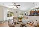 Dining area with access to the patio and an open floor plan with beautiful wood floors at 923 Oleander St, The Villages, FL 32159