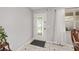Bright foyer with decorative front door and beautiful tile floors at 923 Oleander St, The Villages, FL 32159