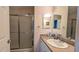 Bright bathroom featuring a walk-in shower with a sliding door at 971 Margaux Trl, The Villages, FL 32162
