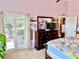 Spacious bedroom with a slider leading to the lanai and a view of the screened outdoor area at 974 Forest Hill Dr, Minneola, FL 34715