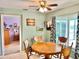 Inviting dining area with a wooden table, surrounded by decor and natural light at 974 Forest Hill Dr, Minneola, FL 34715