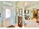 Inviting entryway with decorative door, tile flooring, and wall decorations, leading into the home's welcoming interior at 974 Forest Hill Dr, Minneola, FL 34715