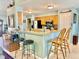 Open kitchen with breakfast bar, stainless steel appliances, and plenty of cabinet space at 974 Forest Hill Dr, Minneola, FL 34715