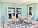 Relaxing screened lanai featuring a stylish outdoor dining set and a view of the inviting pool at 974 Forest Hill Dr, Minneola, FL 34715