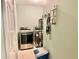 Functional laundry room with modern washer and dryer, plus shelving for storage at 974 Forest Hill Dr, Minneola, FL 34715