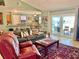 Spacious living room with tile floors and open access to the kitchen and patio, great for entertaining and relaxed living at 974 Forest Hill Dr, Minneola, FL 34715