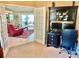 Office space with desk setup, opening to the living room, is perfect for remote work or study, offering both functionality and style at 974 Forest Hill Dr, Minneola, FL 34715