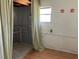 Bathroom or laundry area with stall and window at 1030 Vermont Ave, Lady Lake, FL 32159