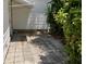 Side patio area with decorative foliage at 1030 Vermont Ave, Lady Lake, FL 32159