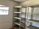 Organized storage space with shelving units at 1030 Vermont Ave, Lady Lake, FL 32159