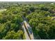 Serene aerial view of a quiet neighborhood surrounded by lush greenery and mature trees at 111 Kentucky Blue Cir, Apopka, FL 32712
