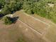 Expansive acreage with equestrian facilities, featuring a horse training ring and fenced paddock for horses at 111 Kentucky Blue Cir, Apopka, FL 32712