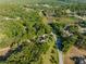 The aerial image reveals the home's position near vast green areas and a small pond, enhancing its appeal at 111 Kentucky Blue Cir, Apopka, FL 32712