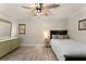Bedroom with an overhead fan, closet space, and a window with wooden shutters at 111 Kentucky Blue Cir, Apopka, FL 32712