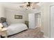 Bedroom showcases a ceiling fan and connecting door to the home's bathroom at 111 Kentucky Blue Cir, Apopka, FL 32712