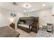 Bright bedroom featuring a unique wooden bunk bed with built-in storage steps and a warm, inviting atmosphere at 111 Kentucky Blue Cir, Apopka, FL 32712