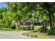An inviting home with stone accents, lush greenery, and a charming mailbox in a serene neighborhood at 111 Kentucky Blue Cir, Apopka, FL 32712