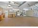 Large garage with ample storage, a utility sink, and an exit door for easy access to the outdoors at 111 Kentucky Blue Cir, Apopka, FL 32712
