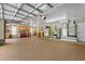 Spacious garage featuring built-in cabinetry, work surfaces and durable epoxy flooring throughout the space at 111 Kentucky Blue Cir, Apopka, FL 32712