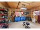 Well organized garage with tool storage, shelving, and an air conditioning unit at 111 Kentucky Blue Cir, Apopka, FL 32712