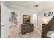 Hallway featuring a dark wooden dresser and views of the staircase with white railings and wood flooring at 111 Kentucky Blue Cir, Apopka, FL 32712