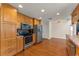 Kitchen features stainless steel appliances, wooden cabinets, and tiled countertops at 111 Kentucky Blue Cir, Apopka, FL 32712