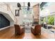 Open-concept living room with high ceilings, stone fireplace, and staircase at 111 Kentucky Blue Cir, Apopka, FL 32712