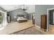 Spacious main bedroom with vaulted ceiling, tiled floor, king bed, and ensuite access at 111 Kentucky Blue Cir, Apopka, FL 32712