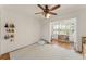 Well-lit playroom featuring a soft rug and an adjoining room with a window seat, perfect for creative play at 111 Kentucky Blue Cir, Apopka, FL 32712