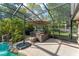 Relaxing outdoor space featuring a spa, pool, and lush greenery within a screened enclosure at 111 Kentucky Blue Cir, Apopka, FL 32712