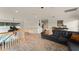 Upstairs room with a couch, hardwood floors and a great view of the living space at 111 Kentucky Blue Cir, Apopka, FL 32712