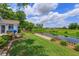 Expansive backyard with private dock, waterfront views, and lush landscaping at 1110 Fairfax St, Leesburg, FL 34748