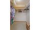 A walk-in closet with shelving and clothing racks at 1110 Fairfax St, Leesburg, FL 34748