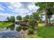 Scenic waterfront view with private dock, tranquil waterway, and lush greenery at 1110 Fairfax St, Leesburg, FL 34748