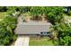 An aerial view of the landscaped home, showcasing the well maintained roof and ample lot at 11114 Lake Eustis Dr, Leesburg, FL 34788