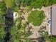 Aerial view of a waterfront home with boat dock, lush landscaping and pool at 11114 Lake Eustis Dr, Leesburg, FL 34788