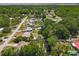 An aerial view of a waterfront property with mature trees at 11114 Lake Eustis Dr, Leesburg, FL 34788