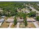 An aerial view of the property showcasing the surrounding neighborhood with views of the bay at 11114 Lake Eustis Dr, Leesburg, FL 34788