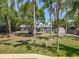Spacious backyard with mature trees, a private dock, and waterfront access at 11114 Lake Eustis Dr, Leesburg, FL 34788