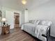 Open view of an additional bedroom featuring wood floors and a comfortable trundle bed at 11114 Lake Eustis Dr, Leesburg, FL 34788